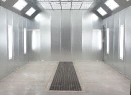 An Empty Powder Coating Booth With A Tiled Floor And A Skylight.