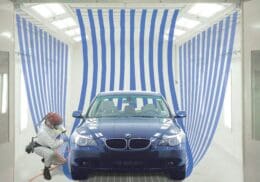 A Car Being Worked On In A Gfs Paint Booths By A Worker.
