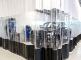 Prep Environments are used to wrap cars in a showroom.
